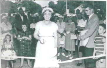 Mrs. George E. Weems cuts the ribbon at the opening of Weems Memorial Hospital in 1959.